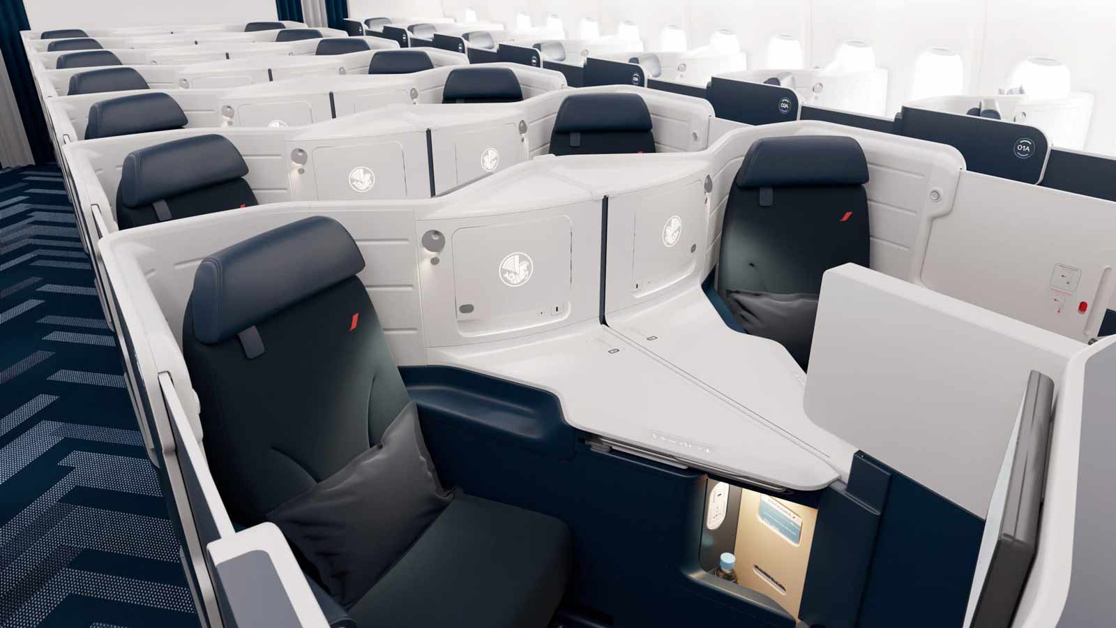 Airline's business class: private, spacious seats with screens.