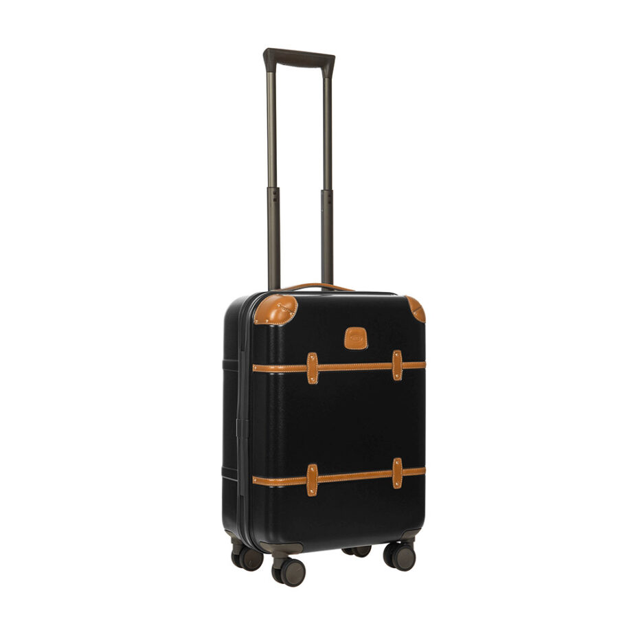 Hard shell suitcase with leather accents and wheels.