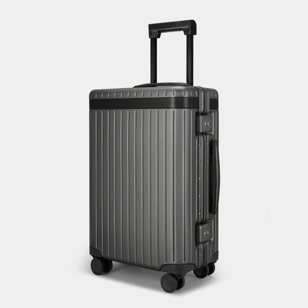 Ribbed suitcase with wheels and visible locks.
