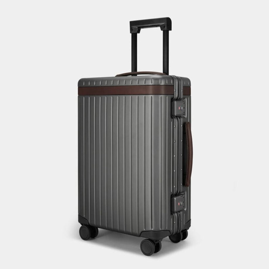 Stylish suitcase with ridges, handles, four wheels.