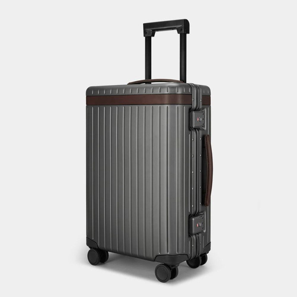Stylish suitcase with ridges, handles, four wheels.