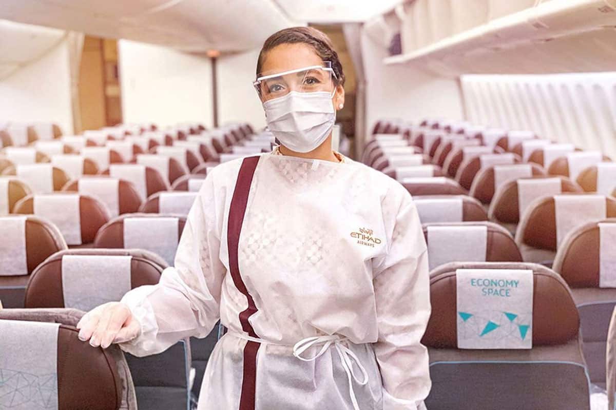 Etihad attendant in protective gear.