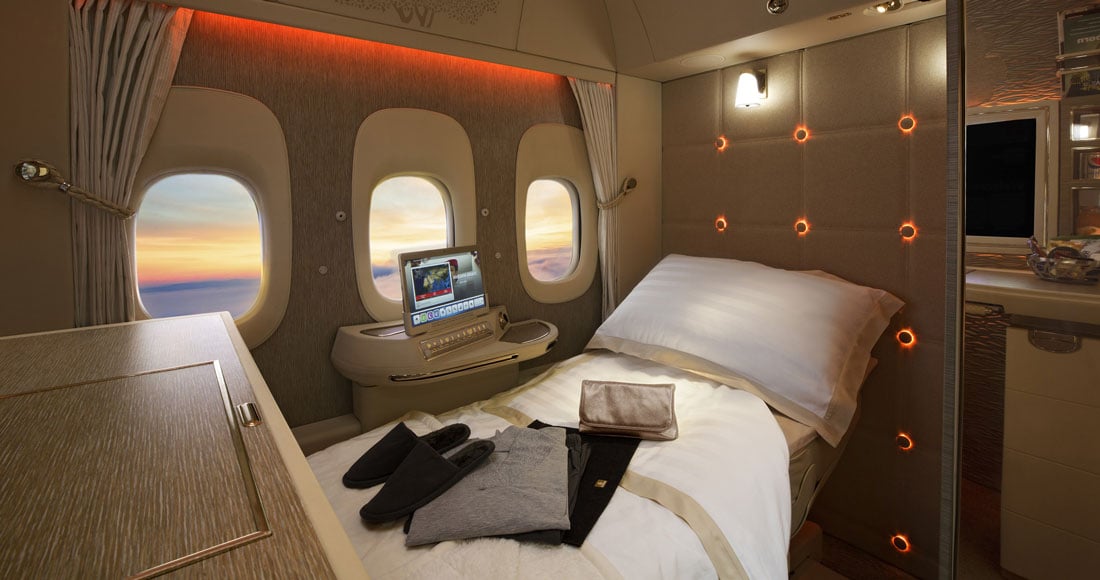 Luxurious first-class cabin, Emirates opulence.