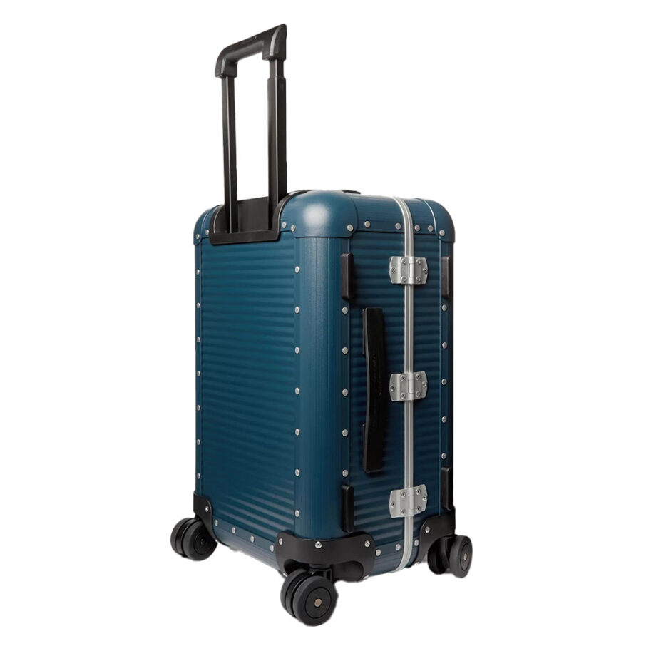 Dark blue suitcase: durable, wheeled carry-on.