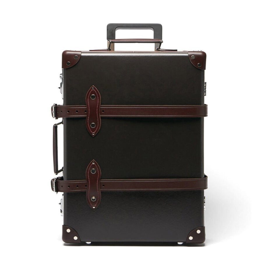 Chic vintage suitcase with leather accents and details.