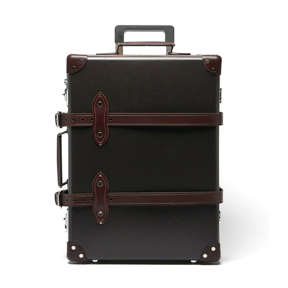 Chic vintage suitcase with leather accents and details.