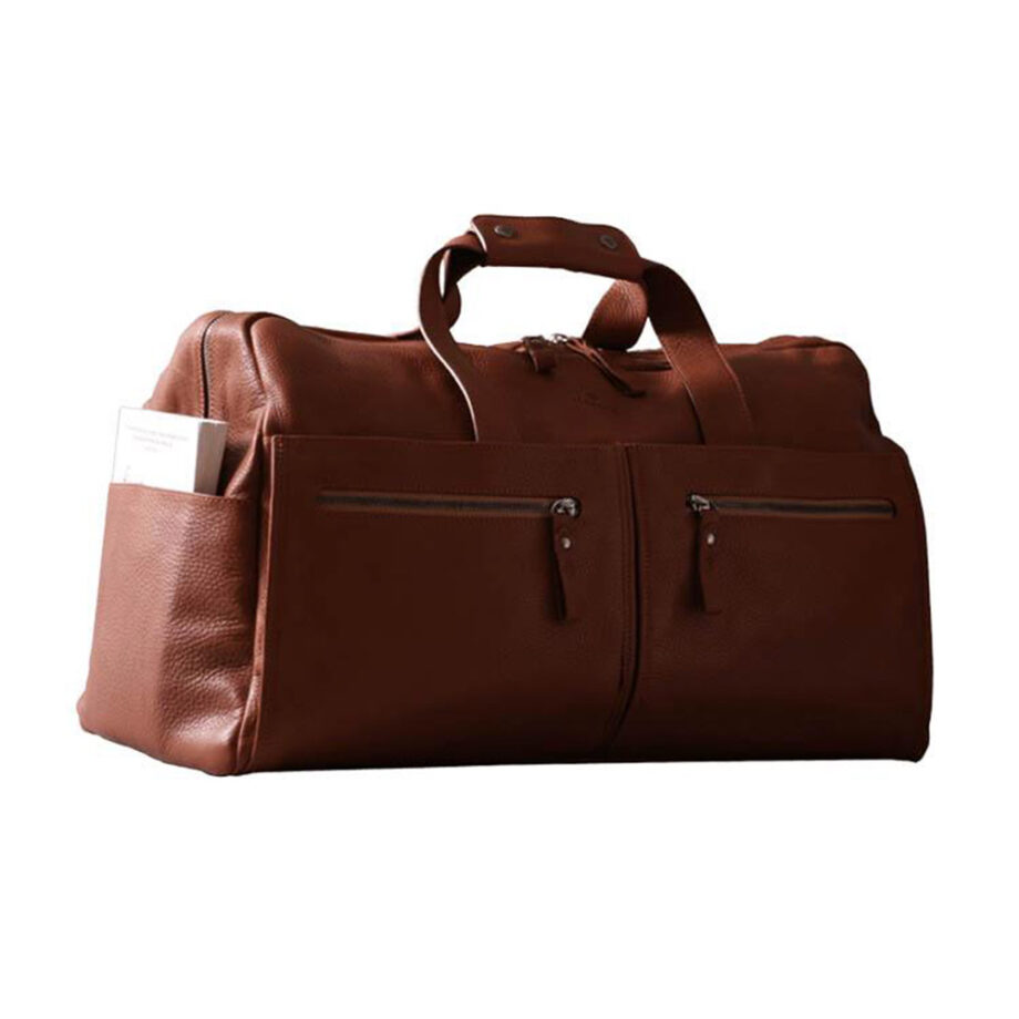 Leather duffel with compartments, sturdy handles.