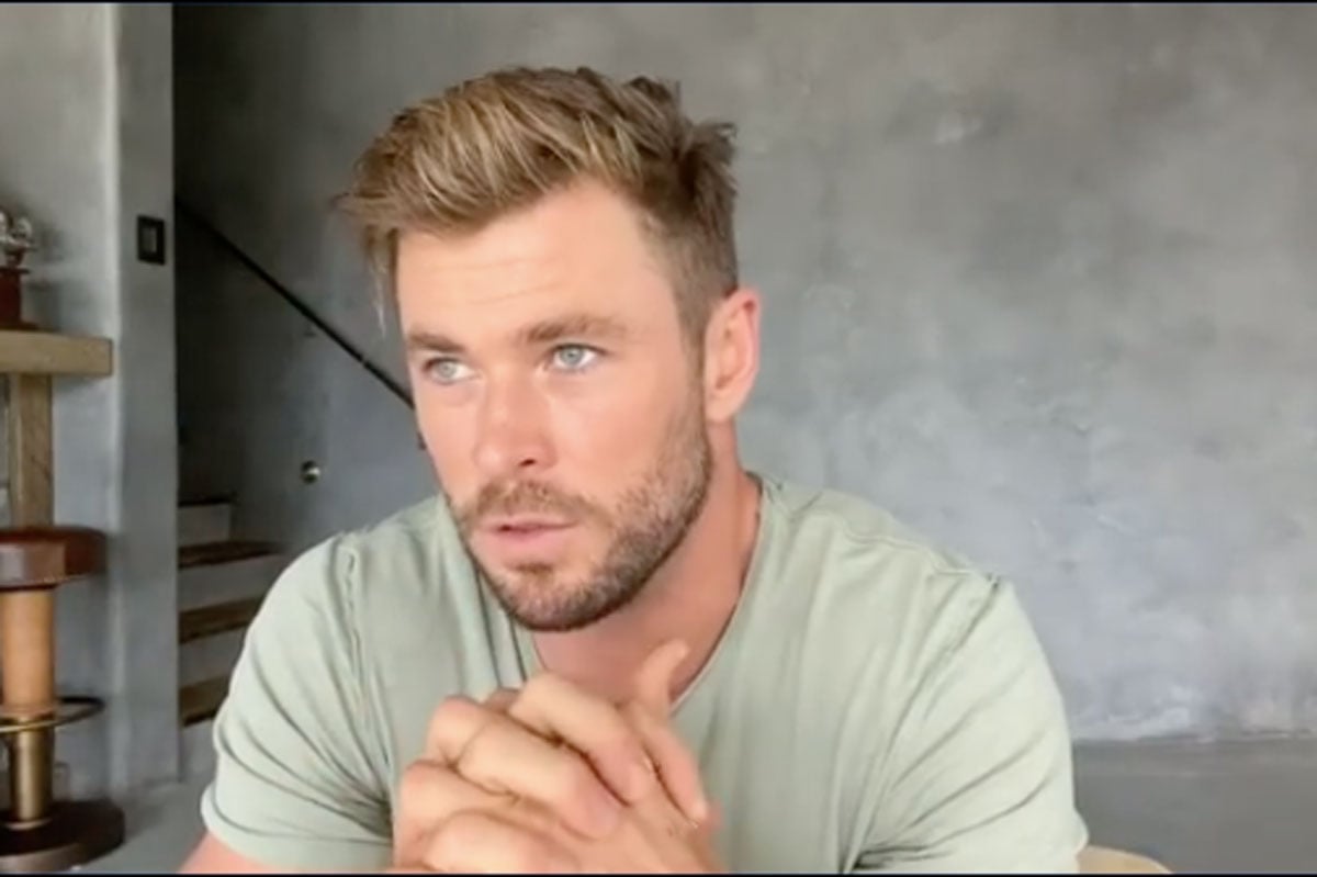 Short-haired man, beard, green shirt.