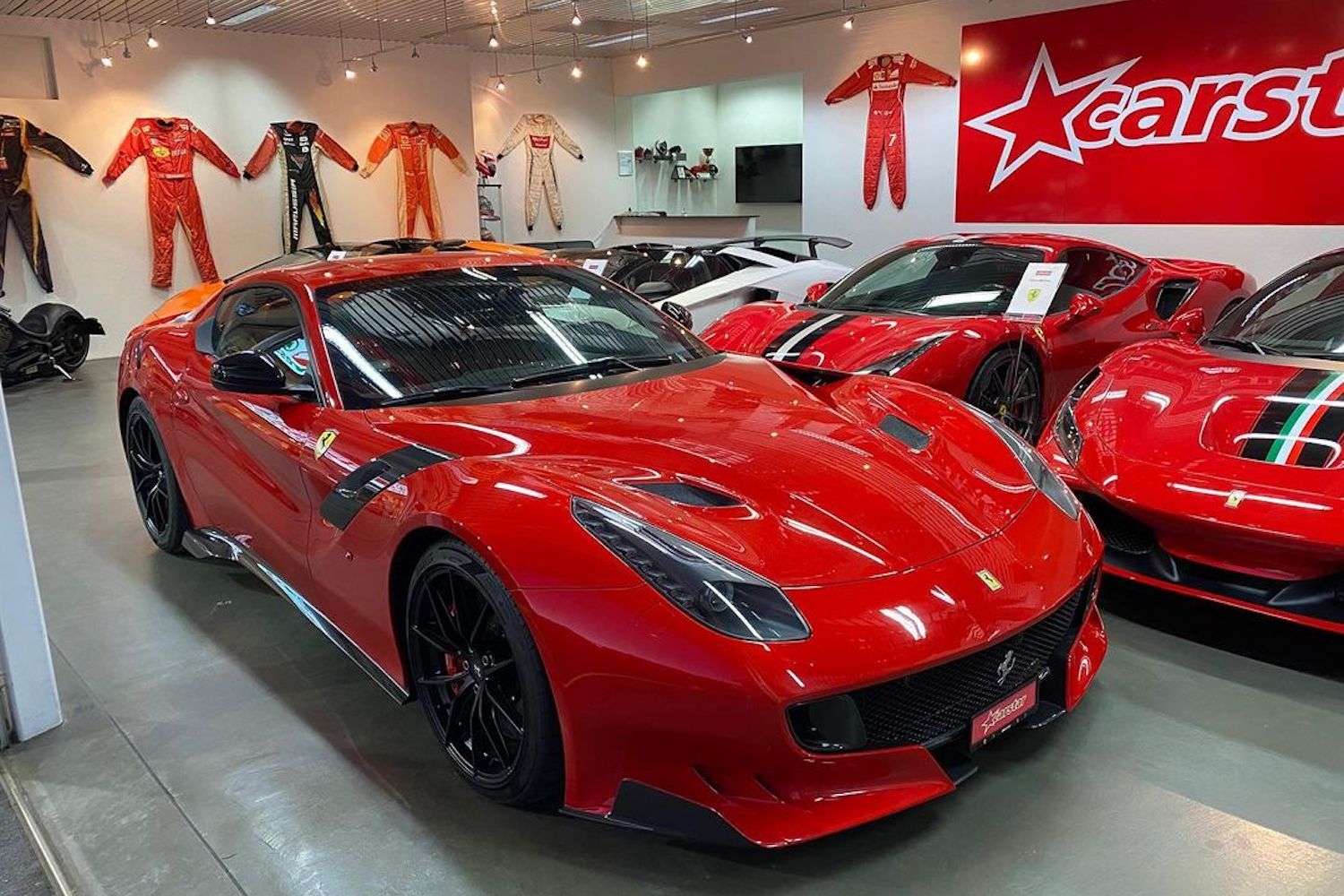 Ferrari in showroom with Kimi Räikkönen vibes.