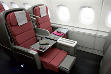 Luxurious Qantas A380-style cabin with amenities.