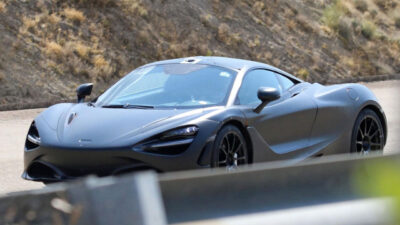 McLaren sports car, desert drive.