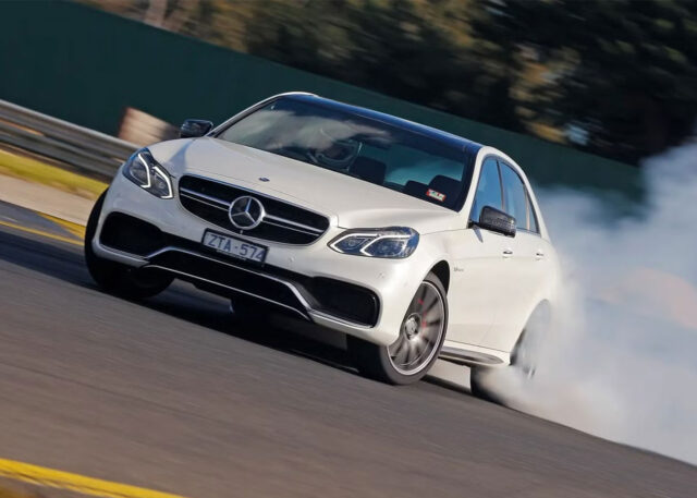 Mercedes-Benz drifts expertly on a race track.