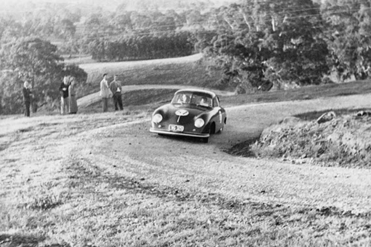Vintage Porsche on dirt road in Australia.