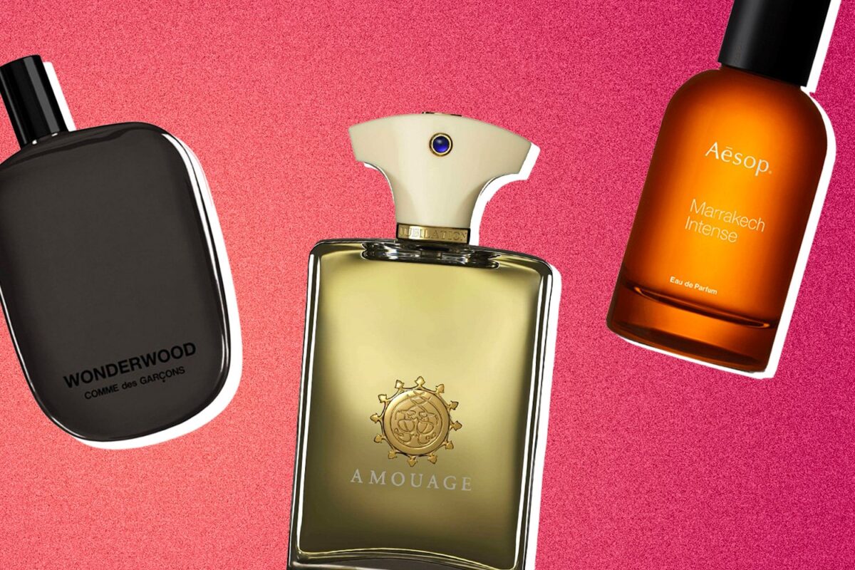 Three distinct men's fragrances against pink background.