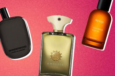 Three distinct men's fragrances against pink background.