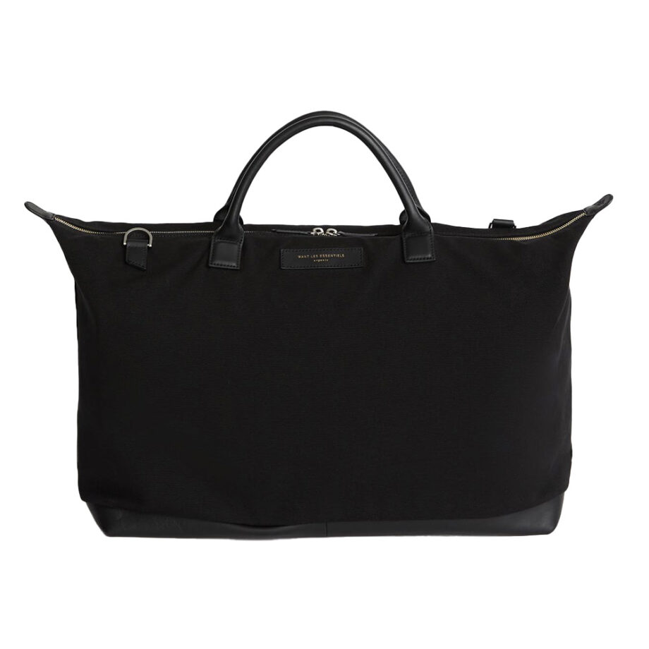 Black leather-handled duffel, ideal for travel.