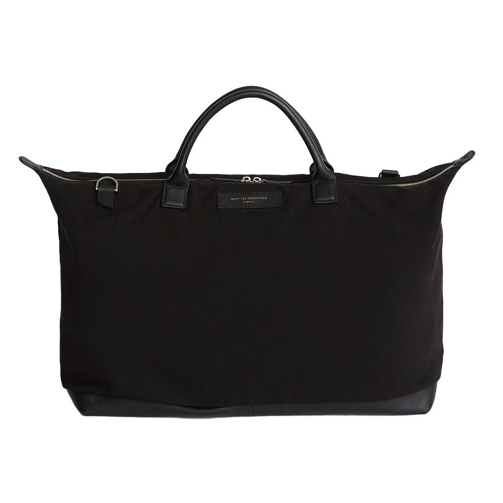 Black leather-handled duffel, ideal for travel.